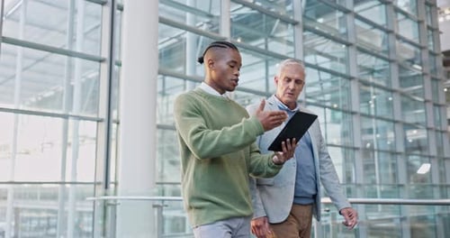 Tablet, conversation and manager talking to man on a corporate project in the office