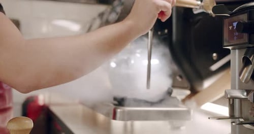 Pouring Coffee Stream From Machine in Cup