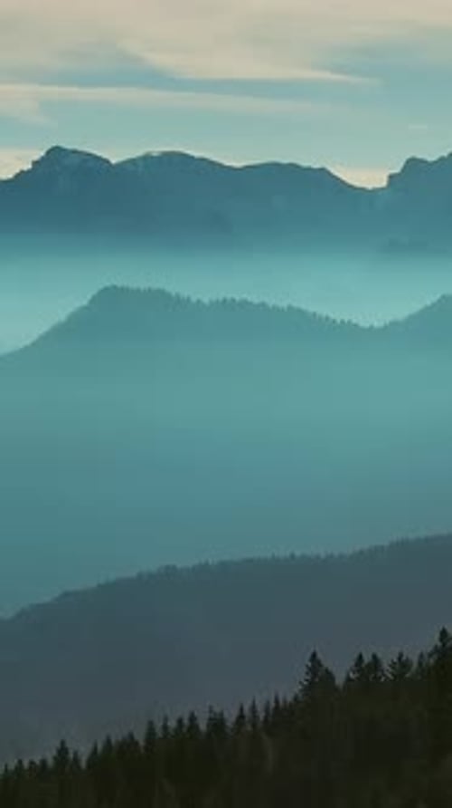 Aerial view of mountains under mist morning
