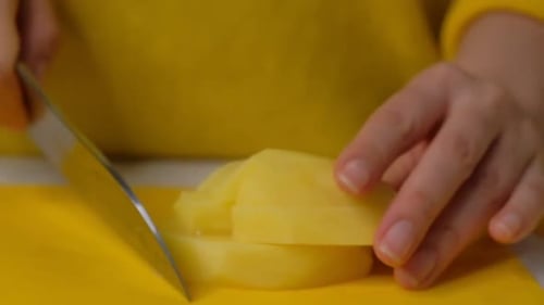 Cutting Potato Into Cubes With Knife
