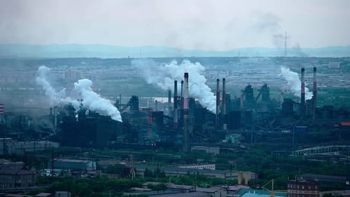 Factory Pipes Producing Dirty Smoke Clouds