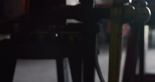 Blacksmith shaping metal with hammer and fire