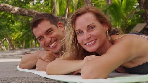 Portrait Of Couple Laying On Beach. Shot On Red Epic For High Quality 4k, Uhd, Ultra Hd Resolution.