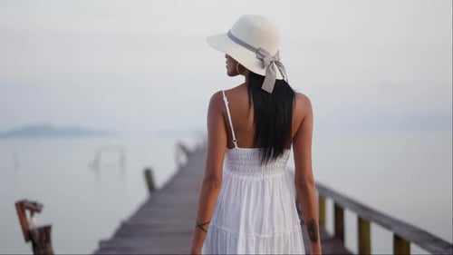 Tracking A Lady's Walk Along The Pier