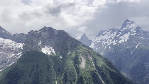 Majestic Mountain Landscape With SnowCapped Peaks and Green Valleys