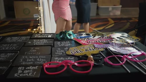 Panning View of Photo Booth Props and Participants