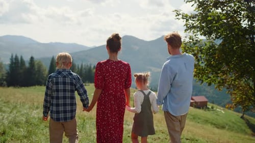 Family Walking Together in Beautiful Mountain Scenery