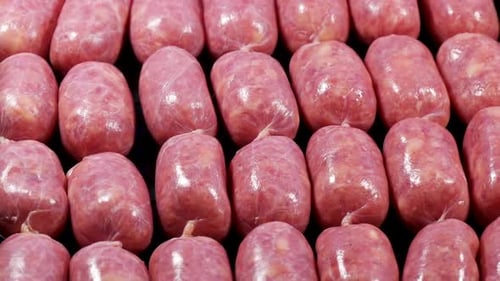 Close-up of Rows of Raw Sausages