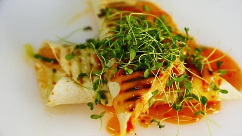 Grilled Tortilla Wraps Topped with Sprouts and Sauce