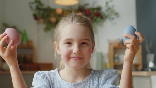 Portrait of Little Girl with Colorful Easter Eggs