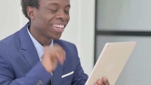Young Man in Suit Video Calling on Tablet