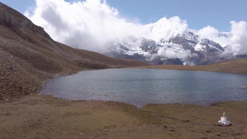 Ice lake, as part of the Annapurna Circuit Trek detour, Himalayas, Nepal. Annapurna chain in the bac