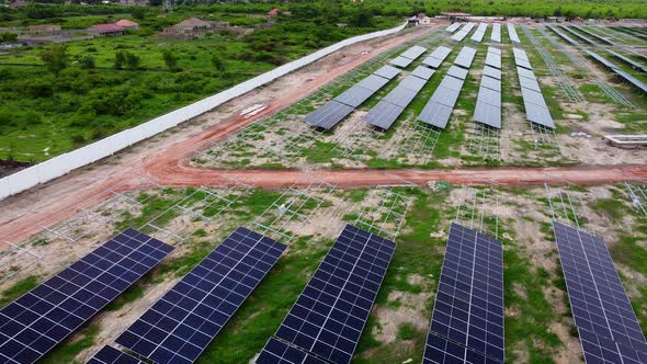 Aerial reverse backside rare rear view of clean newly installed solar ...