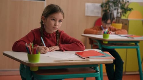 Concentrated Caucasian Kid Child Schoolgirl Primary School Girl Daughter Pupil Learn at Classroom