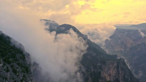 Mountains Covered in Mist During Sunrise or Sunset