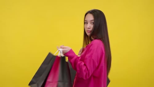 Woman Holding Shopping Bags With Sales