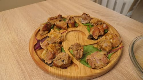 Seasoned Meat on a Wooden Plate Served