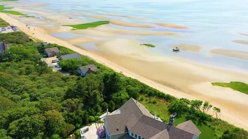 Cape Cod Coastal Homes with Sandy Beachfront and Overcast Skies