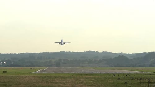 Airplane Taking Off From Runway in Rural Area