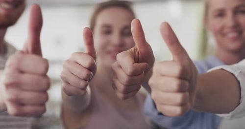 4k video footage of a group of businesspeople showing thumbs up in a modern office