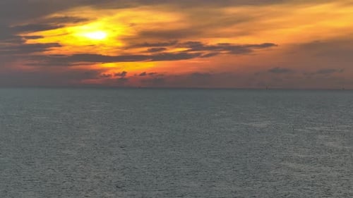The sea appears as a shimmering canvas.