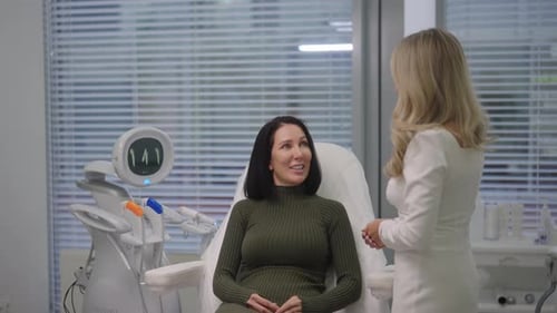 Woman Consults Doctor in Clinic about Facial Treatment