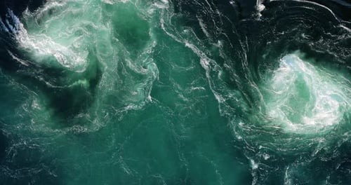 Blue waves of water of the river and the sea meet each other during high tide and low tide.