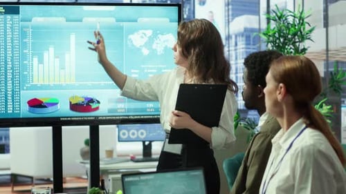 Corporate Associates Look Into Project Details and Timetables in Conference Room