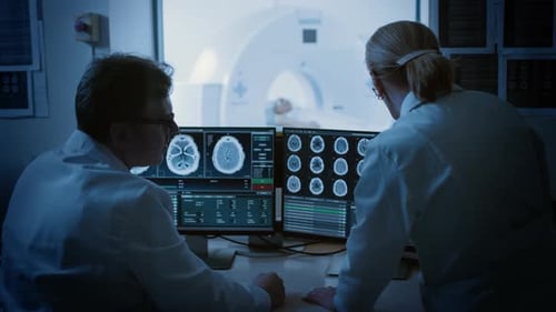 Doctors Analyze CT Scan in Modern Hospital Setting