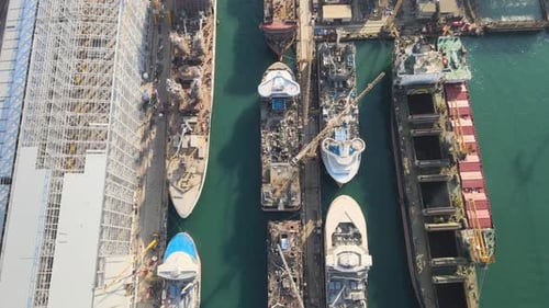 Aerial View of Large Industrial Shipyard With Vessels