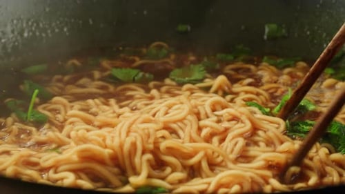 Close up Shot of Noodles Being Stirred