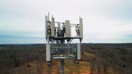 Stunning Aerial Rising Shot of Cell Phone Tower in Middle of Forest. Drone Footage