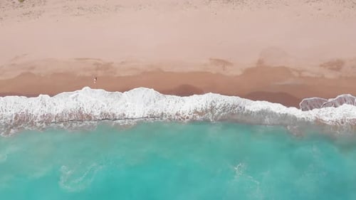 Aerial top down view of beautiful beach in Greece. Dramatic coastline scenic bay sandy beach in the