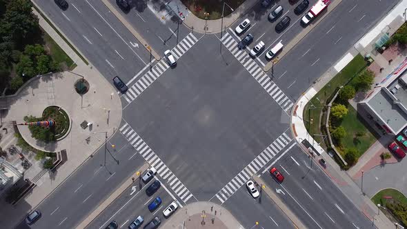 Public transit buses, pedestrians, bikes and vehicles at busy city ...
