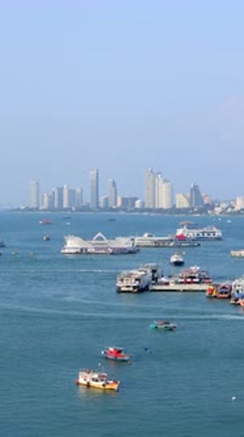 Pattaya cityscape vertical time lapse video from a viewpoint on a hill. Pattaya city, Thailand.