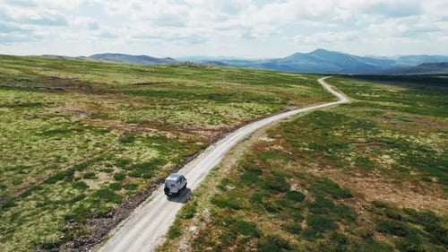 Aerial of Camper Van Drive Off Road on Mountain