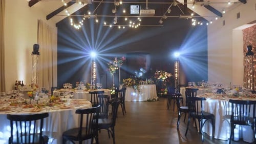 Festive Banquet Hall with Decorated Tables Working Dynamic Illumination