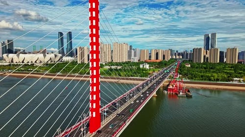 Traffic Crossing Qiantang River Bridge in Hangzhou China During the Day with Modern Buildings and