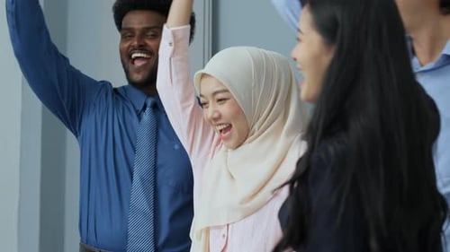 Diverse Group of Colleagues Celebrating Success in Office