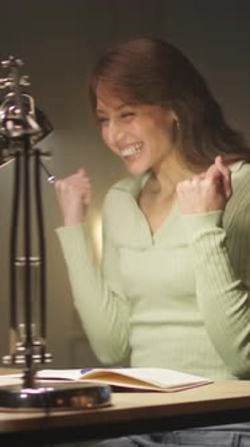 Joyful Woman Celebrates Female Professional Expresses Enthusiasm After Triumphing in Virtual Team