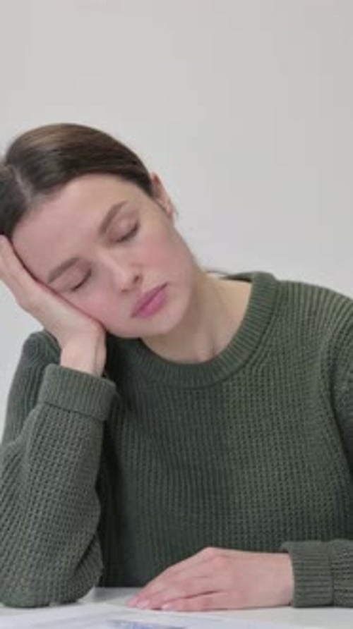 Woman Sleeping with Head Resting on Hand