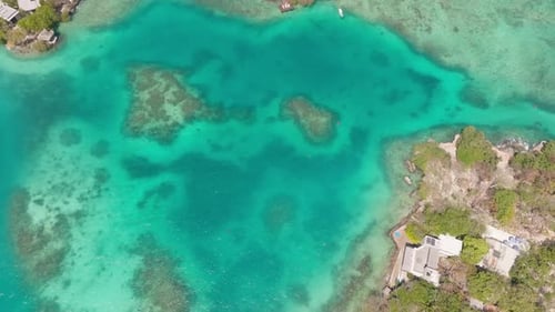 Drone view of Isla Grande in Rosario Islands, Colombia, surrounded by crystal clear Caribbean