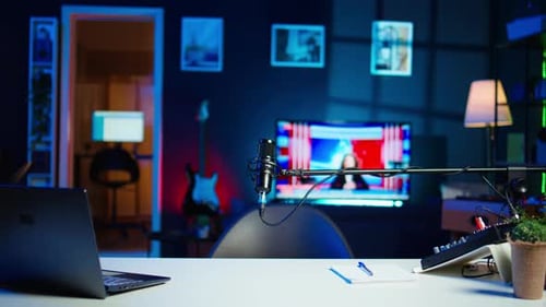 TV Screen Showing News Broadcast and Recording Mic in Home Studio