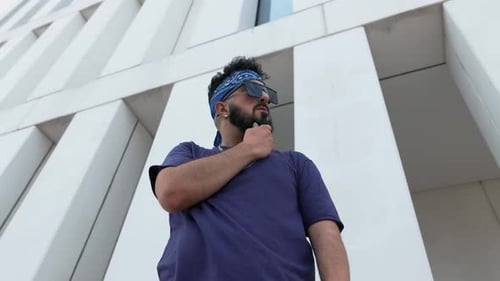 Stylish Bearded Man in Urban Setting Posing for a Cool Portrait