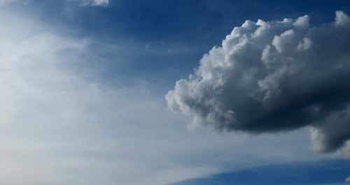 Puffy Clouds on Blue Sky