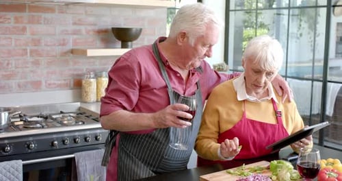 Senior Couple Cooking Together in Bright Home Kitchen
