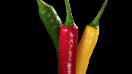 Close Up of Three Colorful Chili Peppers