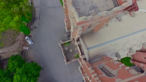 Church 90 degree aerial rotational view, A van parked at the front of an old beautiful of the Church