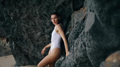 Woman Posing Rocky Coast Leaning at Stone Cliff