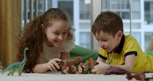 Two Cute Kids Funny Brother and Sister Kids Playing Dinosaurs